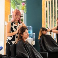 hairdressers working in a hair salon - hairstyle stock pictures, royalty-free photos & images