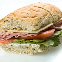 half ham and cheese submarine sandwich - junk food stock pictures, royalty-free photos & images