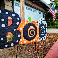halloween boo decoration in front of suburban californian house with flag - garden decoration stock pictures, royalty-free photos & images