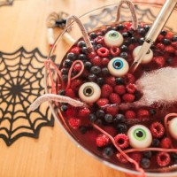 halloween dessert with berries and floating eyeballs, close-up - food stock pictures, royalty-free photos & images