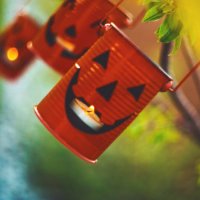 halloween jack o'lantern with candles hanging in tree at dusk - garden decoration stock pictures, royalty-free photos & images