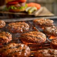 hamburgers on the bbq - food stock pictures, royalty-free photos & images