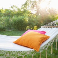 hammock with pillows in garden at sunset - home decoration stock pictures, royalty-free photos & images