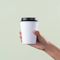hand holding a reusable coffee cup - junk food stock pictures, royalty-free photos & images