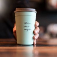 hand holding deposit cup for coffee to go, close-up - junk food stock pictures, royalty-free photos & images