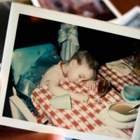 hand holds vintage photograph of boy at thanksgiving - food stock pictures, royalty-free photos & images