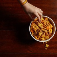hand reaching for bowl of junk food snacks - flat lay copy space - junk food stock pictures, royalty-free photos & images