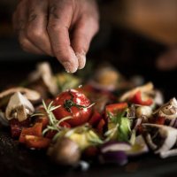 hand seasoning vegetables ona a baking tray - food stock pictures, royalty-free photos & images