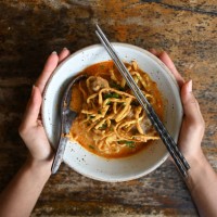 hands holding bowl of khao soi - food stock pictures, royalty-free photos & images