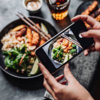 hands of cook photographing asian vegan dish - food stock pictures, royalty-free photos & images