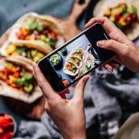 hands of cook photographing mexican tacos - food stock pictures, royalty-free photos & images