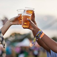 hands of man and women toasting beer at music festival - concert stock pictures, royalty-free photos & images