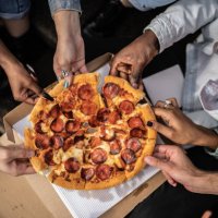 hands picking pizza slices - junk food stock pictures, royalty-free photos & images