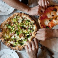 hands reach for naples-style pizza - food stock pictures, royalty-free photos & images