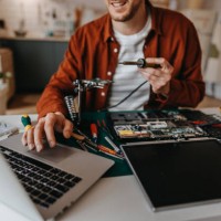 handsome man using laptop on table at home - home decoration stock pictures, royalty-free photos & images
