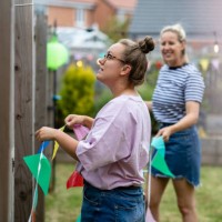 hanging up the bunting - garden decoration stock pictures, royalty-free photos & images