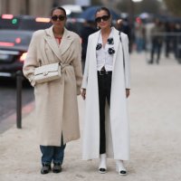 Hanna MW wears black. Sunnies, creme white belted coat, white Chanel Flap Bag Medium size, denim jeans and black and crystal net shoes & Darja...