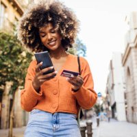 happy afro girl in barcelona shopping online on the move - travel stock pictures, royalty-free photos & images