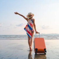 happy asian woman with sunhat enjoy travel on the beach in summer - travel stock pictures, royalty-free photos & images