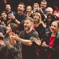 happy audience applauding in the theater - concert stock pictures, royalty-free photos & images