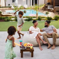 happy black family spending a spring day in the backyard. - garden decoration photos et images de collection