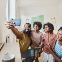 happy black family taking a selfie after moving in into a new apartment. - home decoration stock pictures, royalty-free photos & images