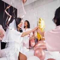 happy bride-to-be and her bridesmaids playing with balloons at a bachelorette party - home decoration stock pictures, royalty-free photos & images