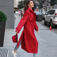 happy brunette in the trendy red raincoat - fashion stock pictures, royalty-free photos & images