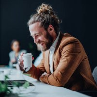 happy business man working on a laptop computer in the office - junk food stock pictures, royalty-free photos & images