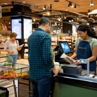 happy cashier working at the supermarket registering products - food stock pictures, royalty-free photos & images