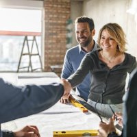 happy couple closed a deal with manual workers at construction site. - home decoration stock pictures, royalty-free photos & images