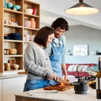 happy couple cooking food together at home - food stock pictures, royalty-free photos & images