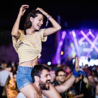happy couple having fun on a music festival by night. - concert stock pictures, royalty-free photos & images