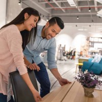 happy couple shopping at a furniture store - home decoration stock pictures, royalty-free photos & images