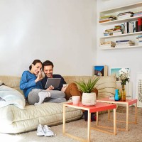 happy couple video chatting on digital tablet - home decoration stock pictures, royalty-free photos & images