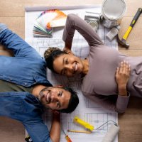 happy couple working on a home improvement project - home decoration stock pictures, royalty-free photos & images