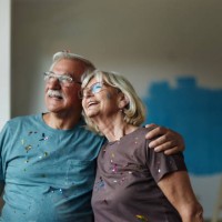 happy embraced senior couple during home renovation process. - home decoration stock pictures, royalty-free photos & images