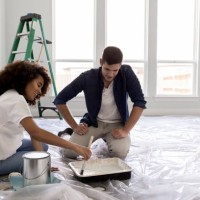 happy expectant couple paint nursery - home decoration stock pictures, royalty-free photos & images