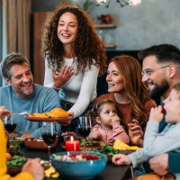 happy extended family celebrating thanksgiving at dining table. - food stock pictures, royalty-free photos & images