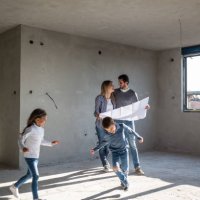 happy family analyzing plans at their new apartment - home decoration stock pictures, royalty-free photos & images