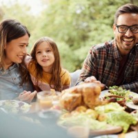 happy family enjoying in lunch outdoors. - food stock pictures, royalty-free photos & images