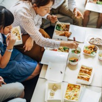 happy family having meal - junk food stock pictures, royalty-free photos & images