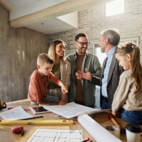 happy family talking to their architect during home renovation process. - home decoration stockfoto's en -beelden
