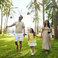 happy family walking in resort garden - travel stock pictures, royalty-free photos & images