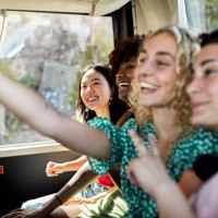 happy female friends taking selfie onboard coach bus - travel stock pictures, royalty-free photos & images