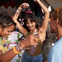 happy festival goers dancing while enjoying at concert - concert stock pictures, royalty-free photos & images