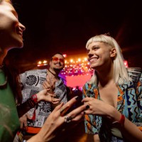 happy friends dancing on music concert by night. - concert stock pictures, royalty-free photos & images