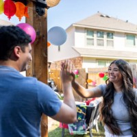 happy friends high fiving and having fun at a party - garden decoration stock pictures, royalty-free photos & images