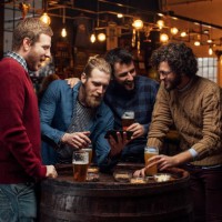 happy gatherings at the pub: group of happy young men taking a selfie while drinking beer - home decoration stock pictures, royalty-free photos & images