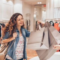 happy girl shopping in the fashion store - fashion stock pictures, royalty-free photos & images